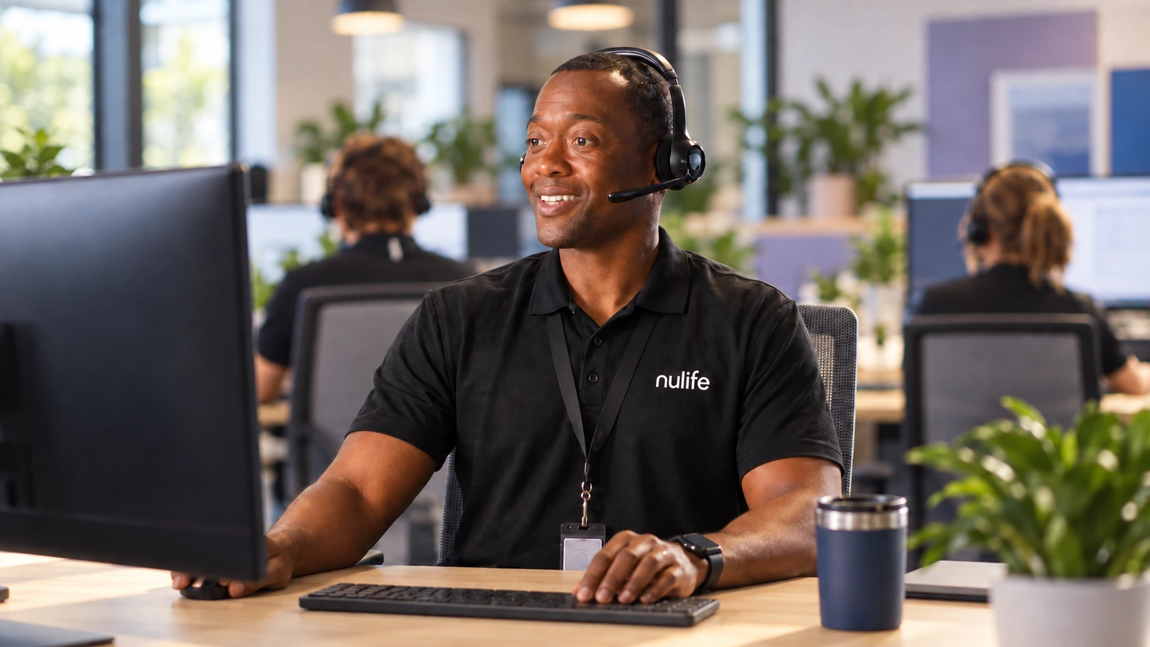 A representative wearing a nulife shirt and headset
